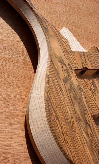 Arm bevel on an ash and bocote custom bass body 