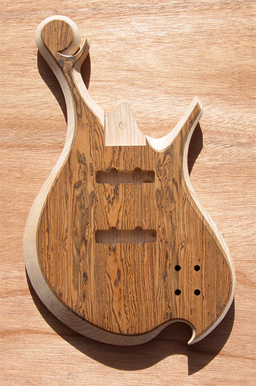 Ash and bocote bass body with carved bevels