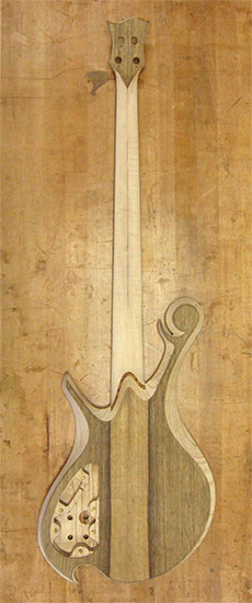 Custom bass with black limba top on back of an ash body