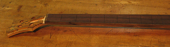 Custom bass neck with black limba binding