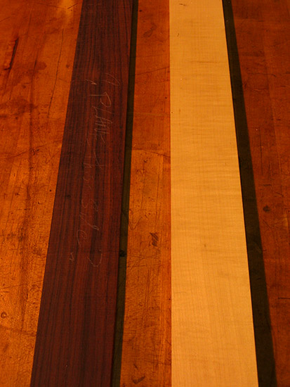 Rosewood and flamed maple grain close up