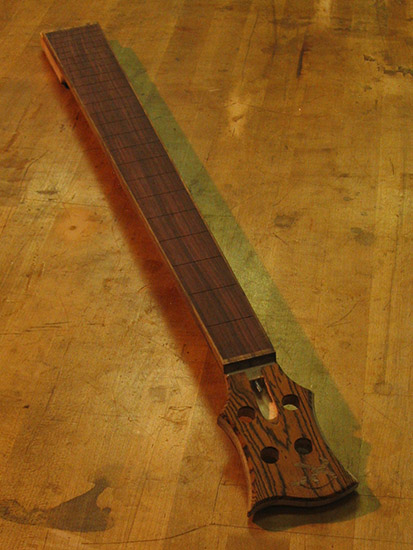 Custom bass neck with bocote headstock and indian rosewood fretboard
