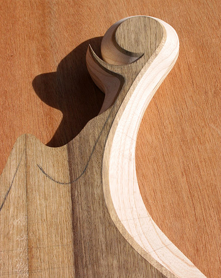 Black limba top on an ash bass scroll