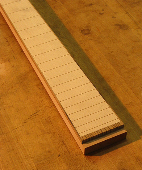 Custom bass neck with slotted maple fretboard