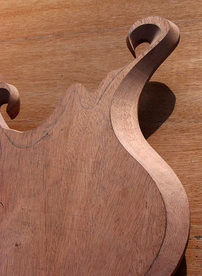 Belly bevel (body bevel) carved into the mahogany core of a 5 string bass