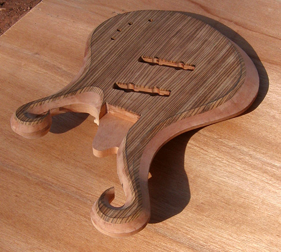 Custom bass with two scrolls and zebrawood top