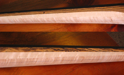 Ebony binding, bocote stringers and birdseye maple neck of the custom 5 string bass from the side