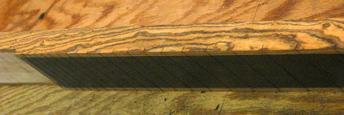 Bocote stringers, ebony fretboard and neck-thru extension of the custom bass guitar
