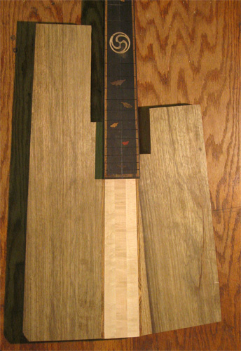 Front of the 5 string custom bass after black limba sides were glued onto the neck