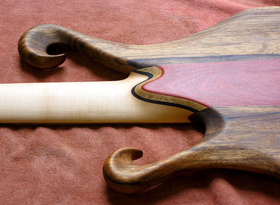 Ebony neck heel of a 6 string bass