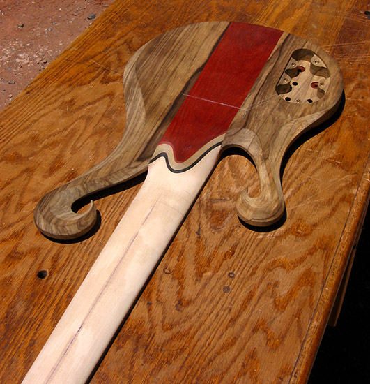 Custom 6 string bass with ebony neck heel and limba body, back