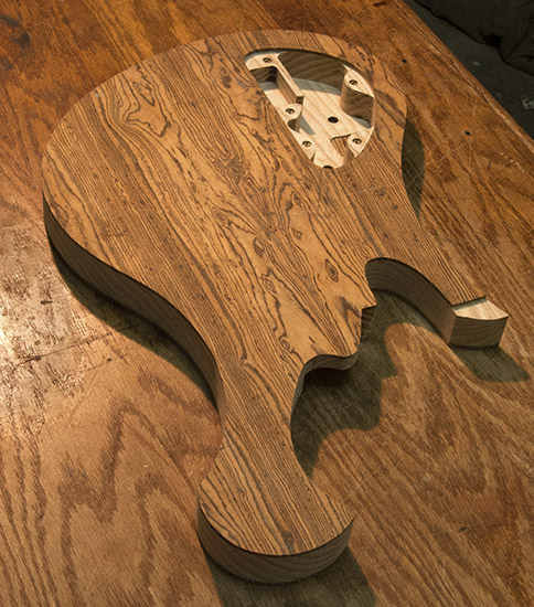 Short scale custom bass body with Xylem scroll, back