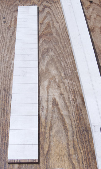 Maple fretboard of a custom bass guitar