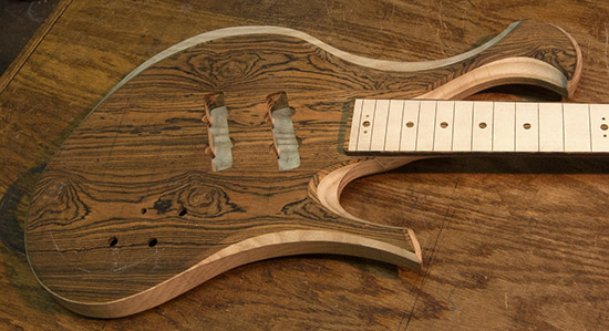 Ash, maple and bocote custom bass guitar, carved