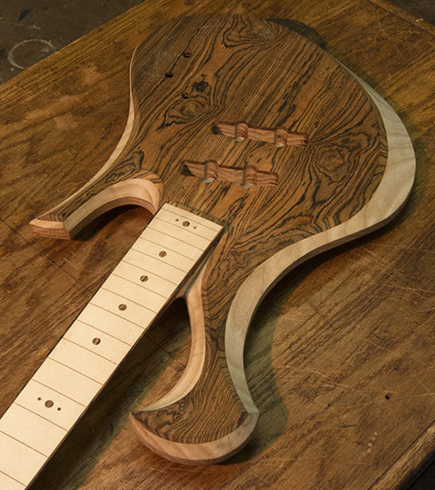 Short scale bass neck with thin profile