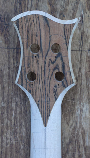 Carved bass headstock with bocote cap, back