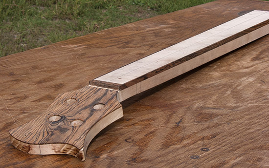 Custom bass neck with maple fingerboard, bocote binding