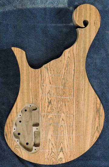 Hook scroll on a bass guitar body under construction