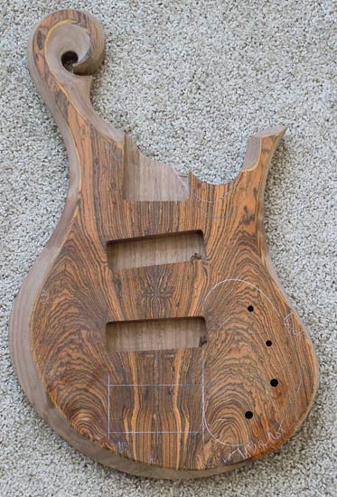 Carved bass guitar body under construction