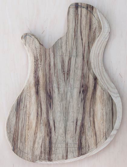 Single-cutway custom bass body, hand-carved