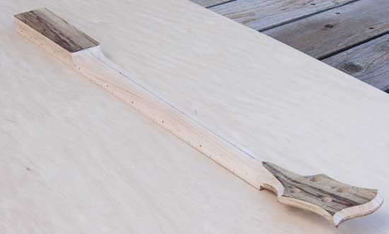 Maple and limba custom bass neck with carved profile