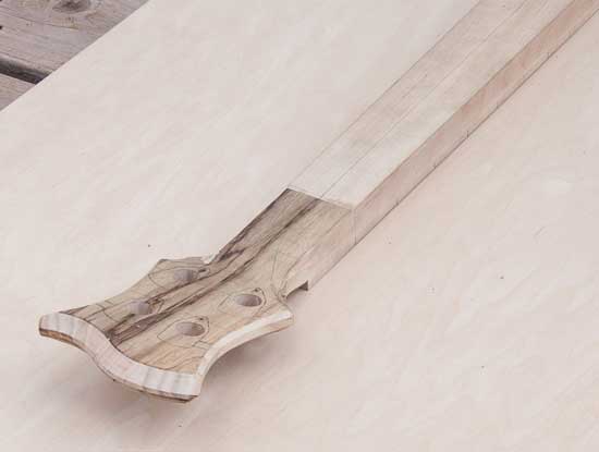 Custom bass neck made of maple, ash, black limba