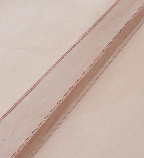 Bass guitar neck before carving, maple w/ mahogany stringers