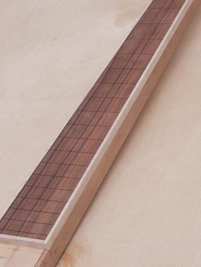 Pau ferro bass fingerboard w/ curly maple binding