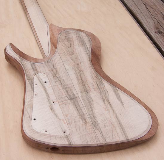 Custom bass with mahogany body, gray maple tops, purpleheart accents