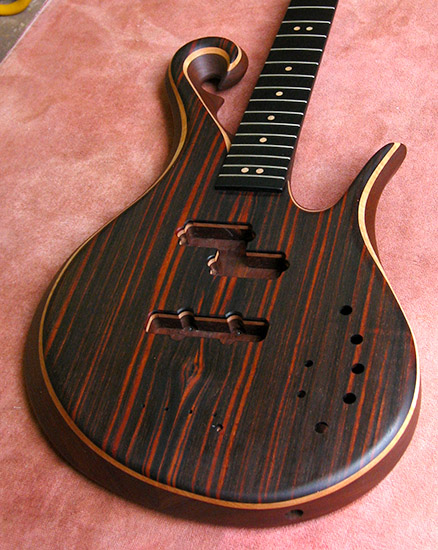 Custom bass lower bout with macassar ebony top, ebony fretboard