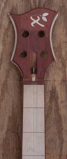 Custom bass with maple fretboard, bloodwood headstock
