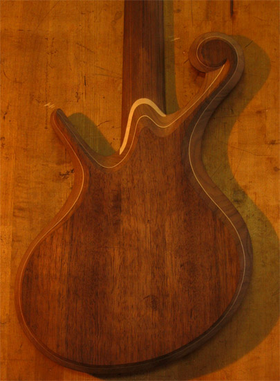 5 string bass body with black walnut top and maple accent stripe