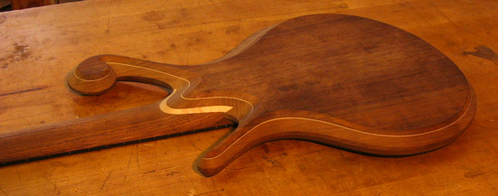 Custom bass neck joint with flamed maple shim