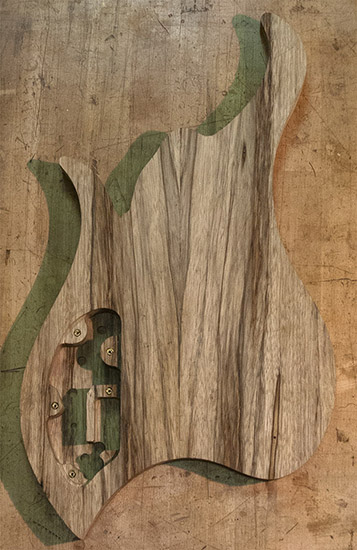 Book-matched black limba body of a Vester Argus-shaped bass