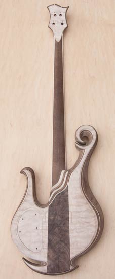Figured walnut and quilted maple tops on a neck-thru bass guitar