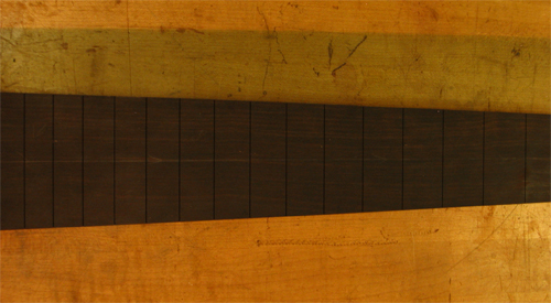 Slotted ebony fretboard with neck taper