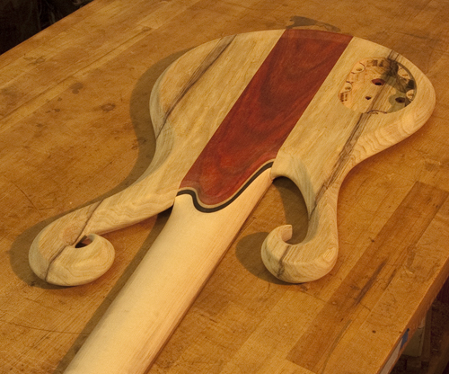 Neck heel, neck and double scrolls of a 6 string bass