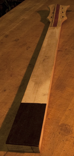 Ebony neck shim on a 6 string bass neck