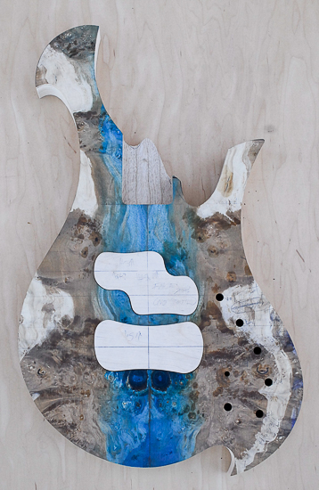 Resin-stabilized maple top on a custom bass guitar body 