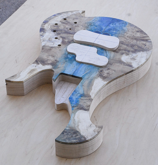 Custom Xylem bass guitar body with resin-stabilized maple top