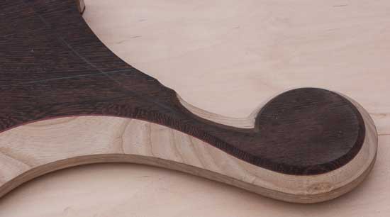 Ball scroll on a custom bass guitar body