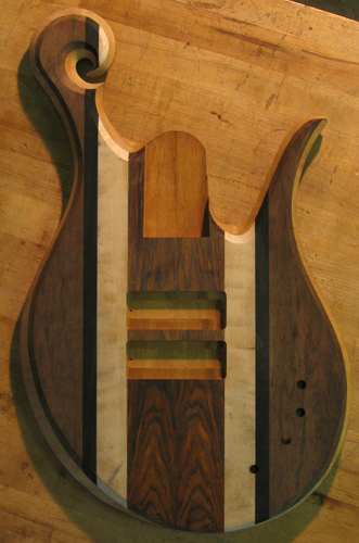 Xylem 5 string bass after carving with striped top wood