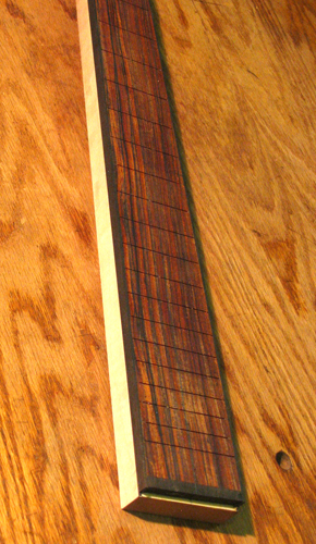 Neck of the custom bass with cocobolo fingerboard and ebony binding