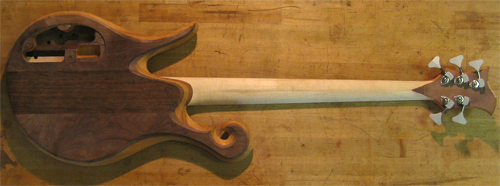 Back of a Xylem bass guitar with a mahogany core and black walnut top wood