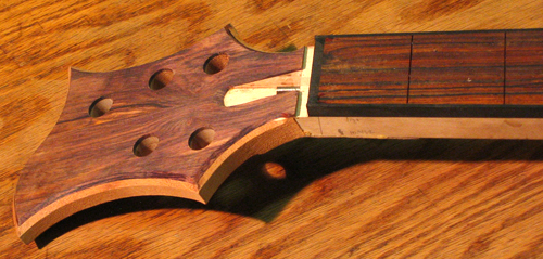 Headstock, truss rod access route, binding and fingerboard of the custom bass