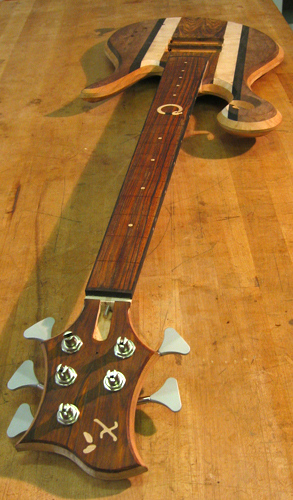 Custom bass guitar's cocobolo headstock with Hipshot Ultralite tuners