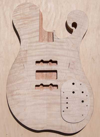 Flamed maple custom bass guitar, single-cut w/ scroll