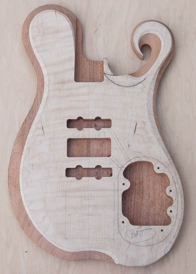 Mahogany bass body with exotic shape and carve