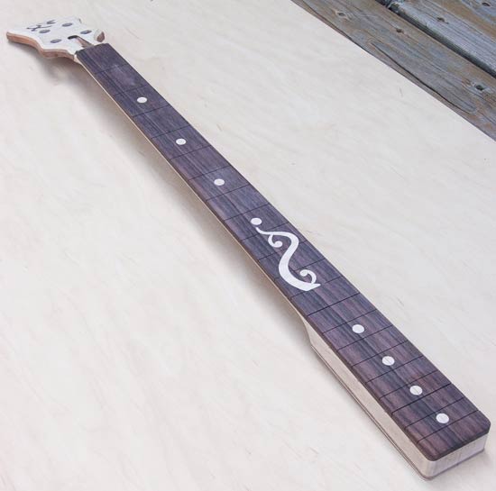 Custom bass neck with custom inlay in rosewood fretboard