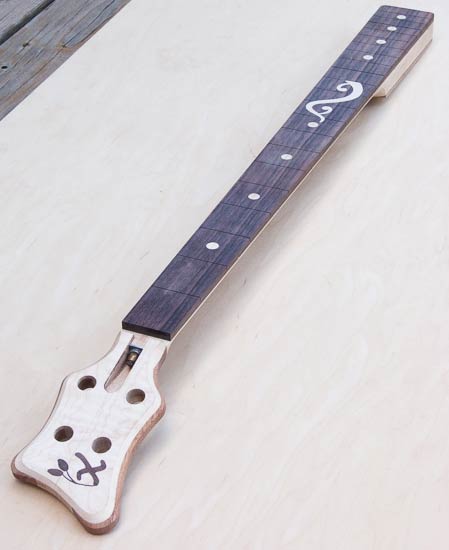 Bass guitar neck with custom inlay, rosewood fretboard